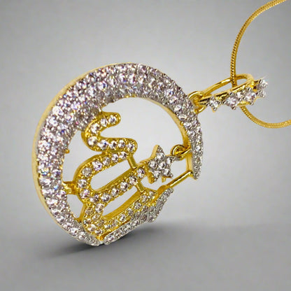 A gold-plated pendant with the text 'Allah' in Arabic calligraphy, adorned with small zirconia stones, displayed against a grey background.